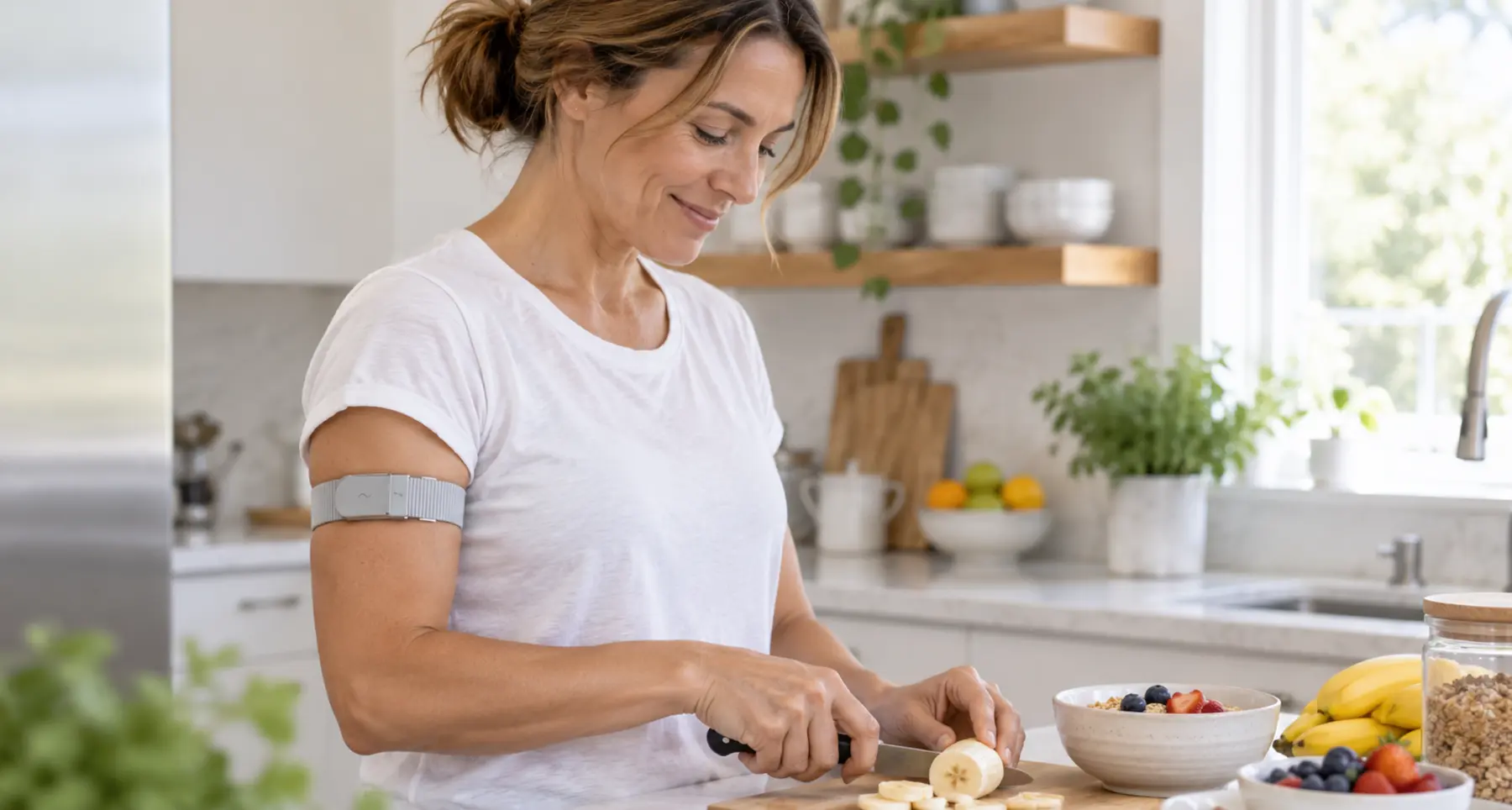 Woman preparing a healthy meal while wearing a slim upper-arm band